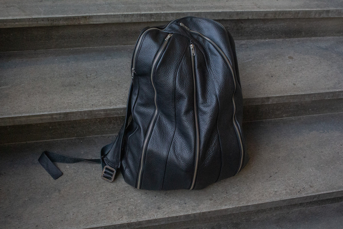Multi-zipper backpack. 1