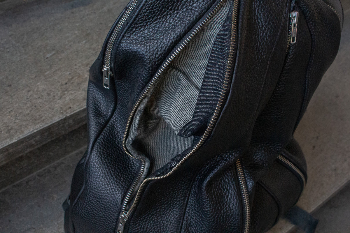 Multi-zipper backpack. 4